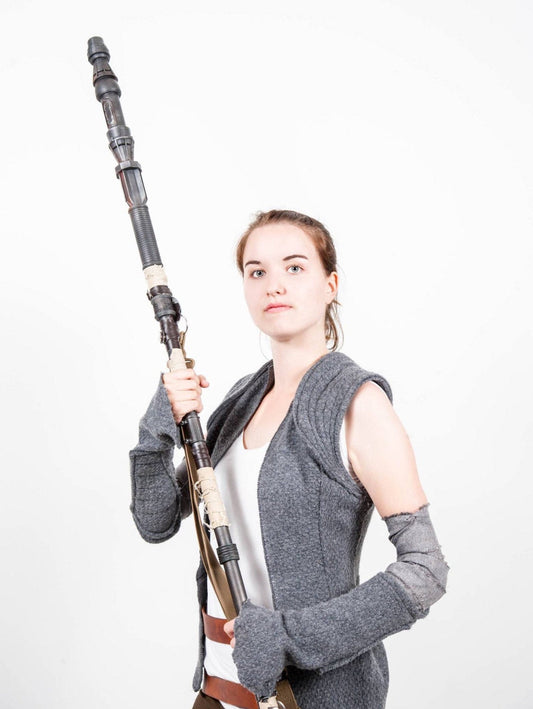 Star wars Rey cosplayer holding Rey Staff