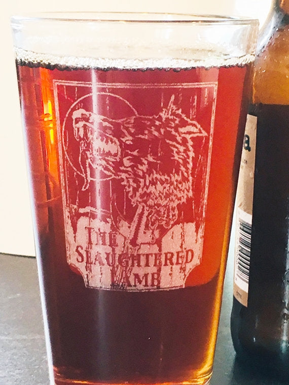 The slaughtered Lamb pub sign engraved on a beer glass