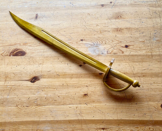 toy wooden sword on table